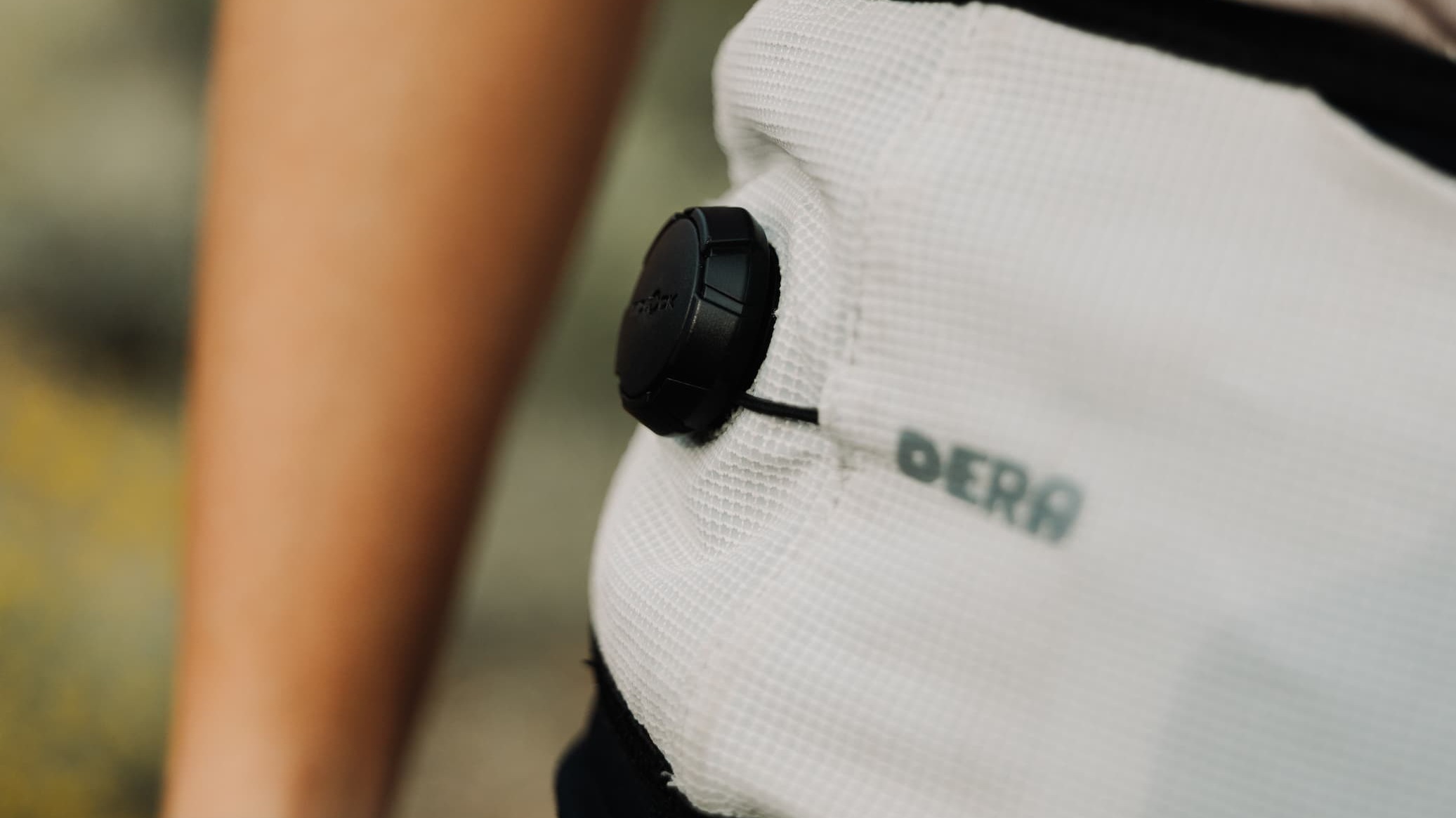 A person wearing a running belt with a wristband