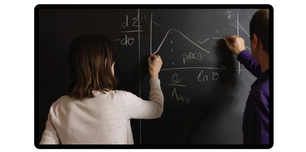 Mathematicians working on a math problem on a black board
