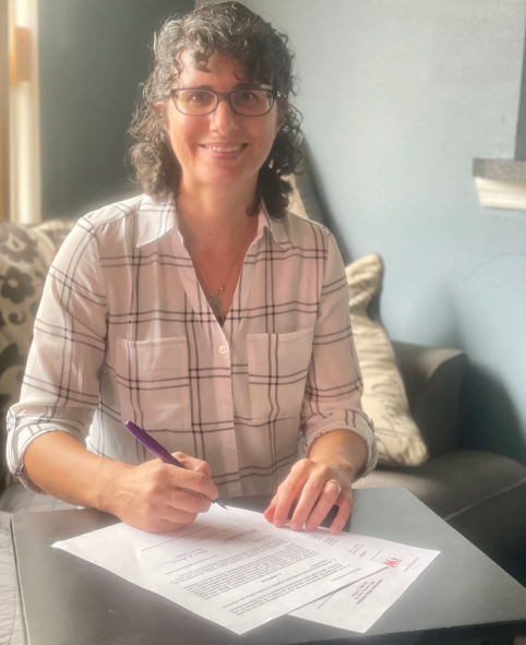 Bethany, signing her author contract