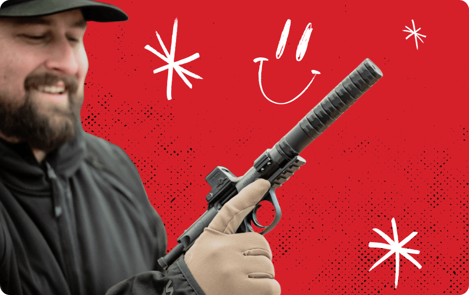 Person holding firearm with suppressor.