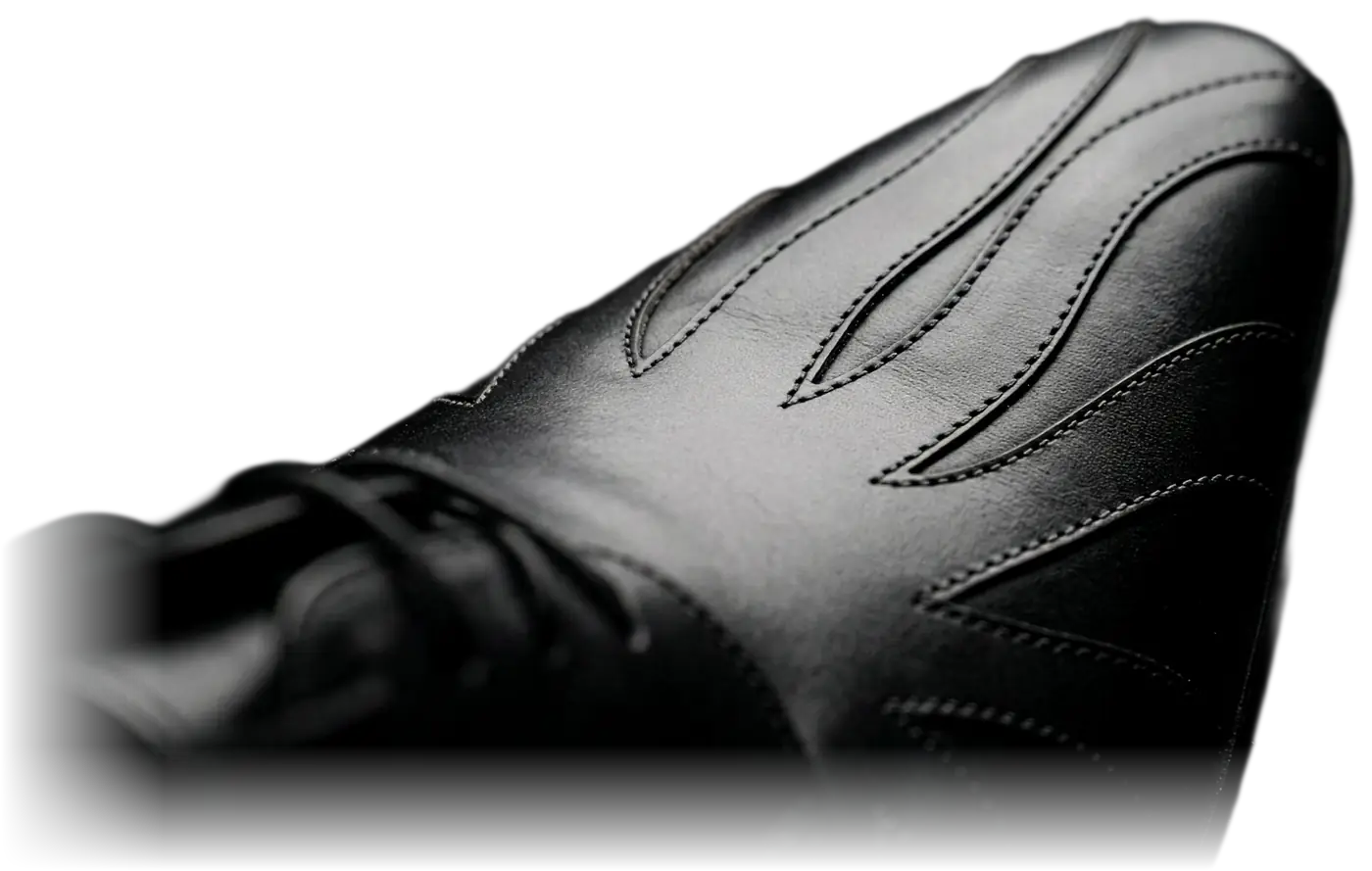 The JAT D-001 Oxford toe with flame panel cutwork, emerging from shadow