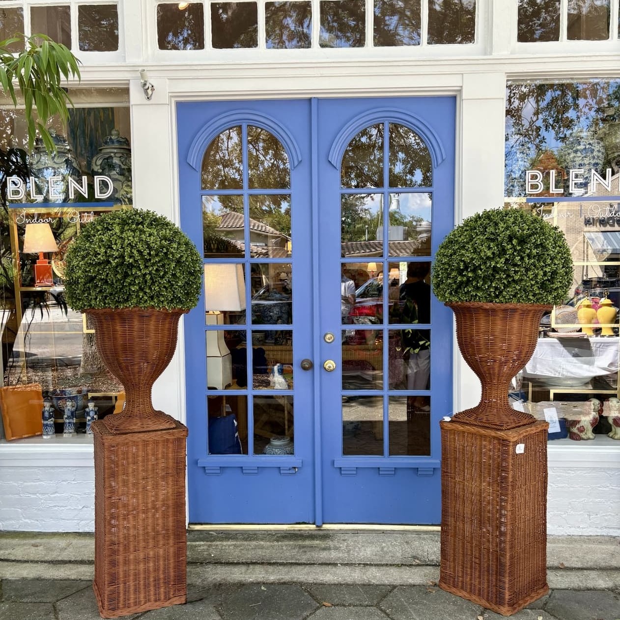Back-in-stock wicker urn and pedestal display perfect for summer greenery or fall dried stems
