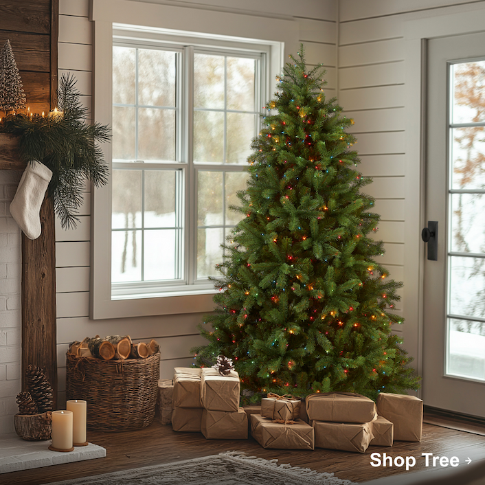 Christmas tree with multicolor lights beside a fireplace and window, surrounded by wrapped gifts in a cozy farmhouse living room.