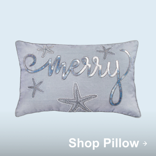 Light blue coastal-themed pillow with silver starfish and the word “Merry” in metallic script.
