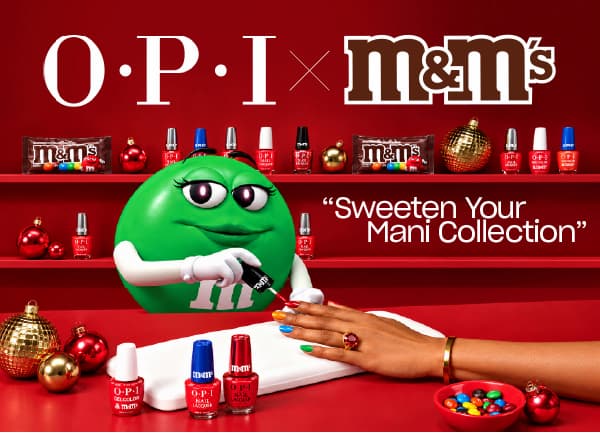OPI × M&M'S Sweeten Your Mani Collection — Green M&M'S painting a manicure with OPI holiday shades
