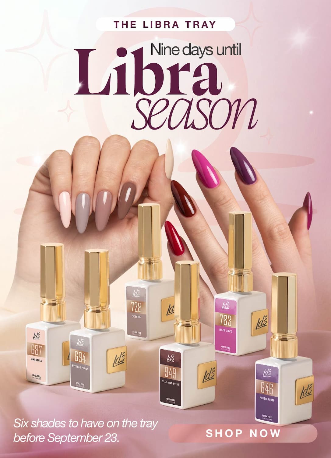 Six fall gel polish bottles arranged in a curve on a soft cream surface with a Libra scales symbol