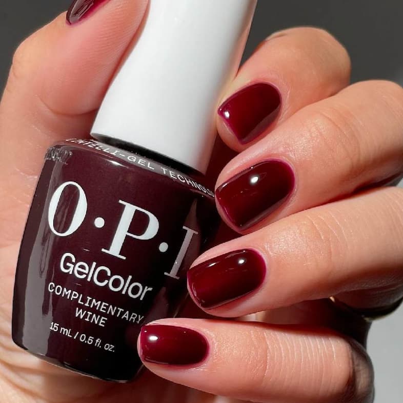 OPI MI12 Complimentary Wine on nails with the bottle