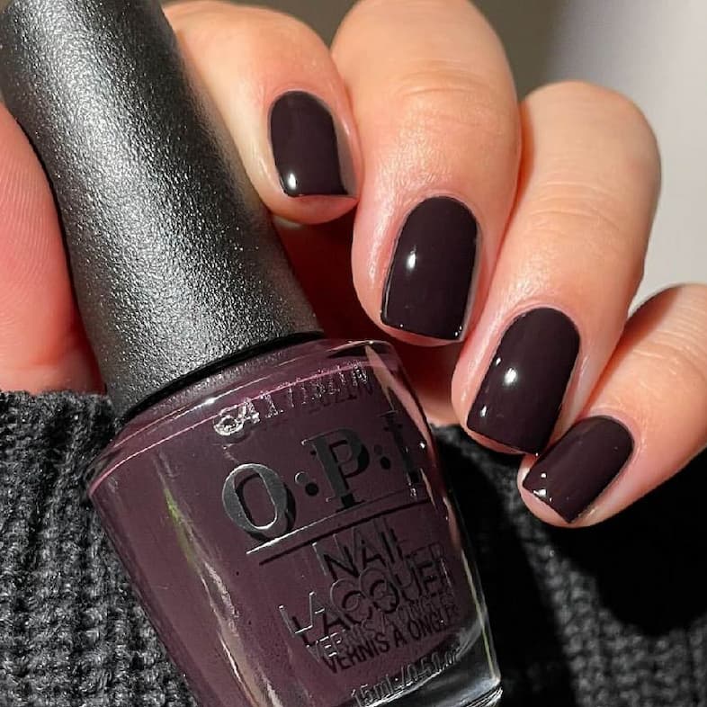 OPI W42 Lincoln Park After Dark on nails with the bottle