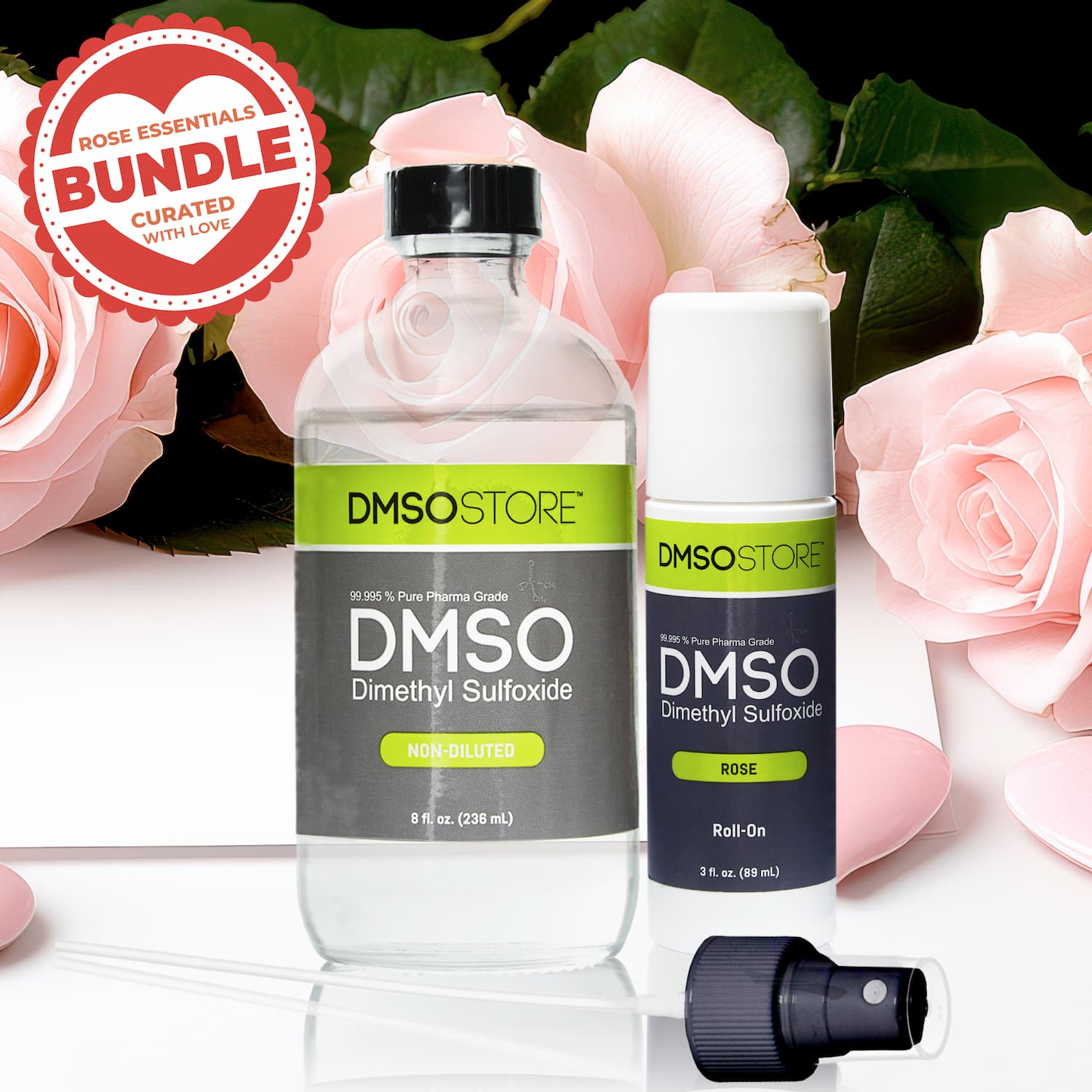 Rose Essentials Bundle featuring non-diluted DMSO liquid, rose DMSO roll-on, and included accessories displayed with pink roses