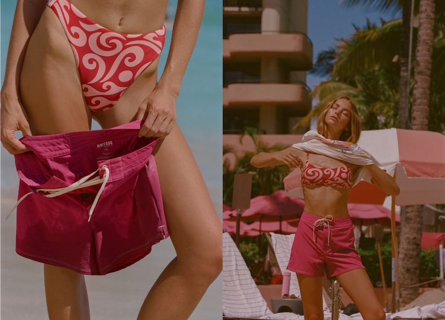 woman wearing a pink boardshort on beach 