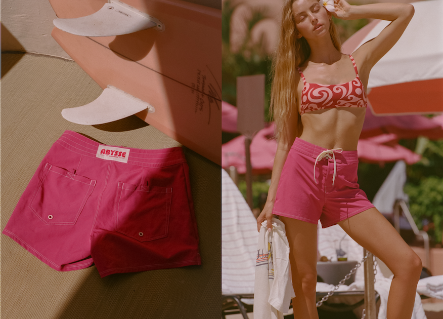 woman wearing a pink boardshort on beach 