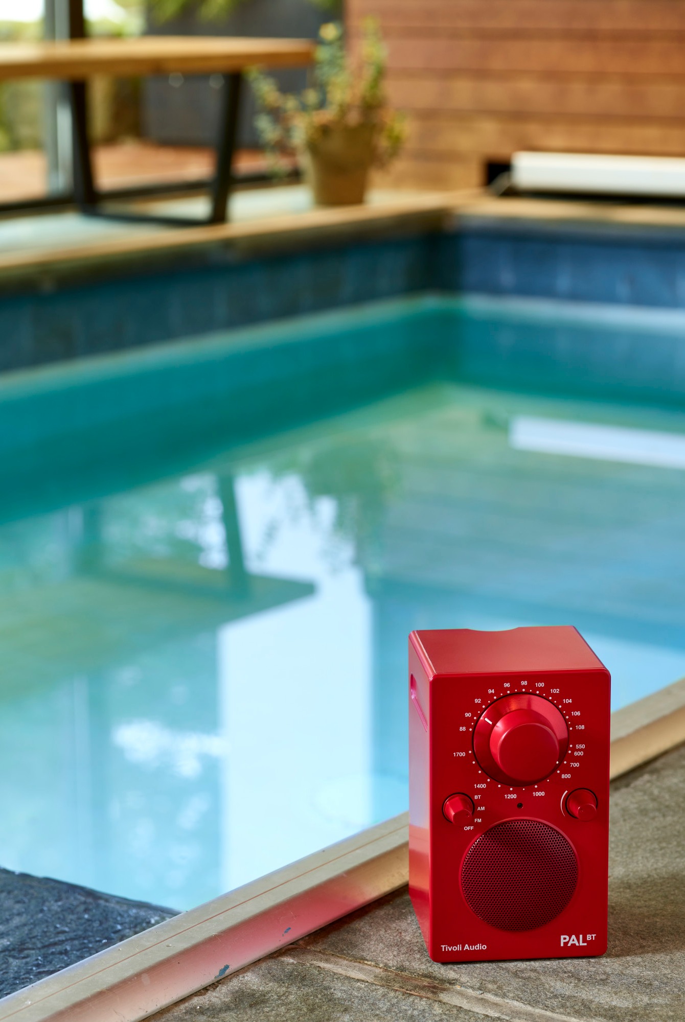 Red Tivoli PAL BT near a pool