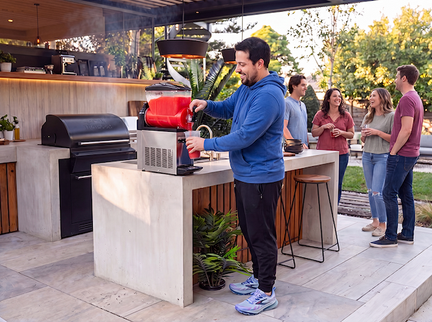 A dad outdoors grilling and entertaining.