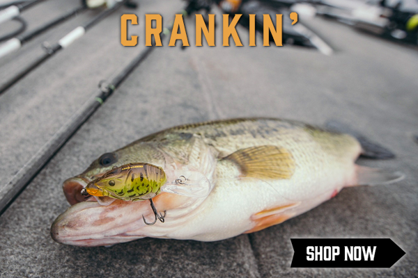 A Bass on the deck of a boat with a crankbait in its mouth with the title "Crankin'" in the top middle of the image and a "Shop Now" button in the bottom right