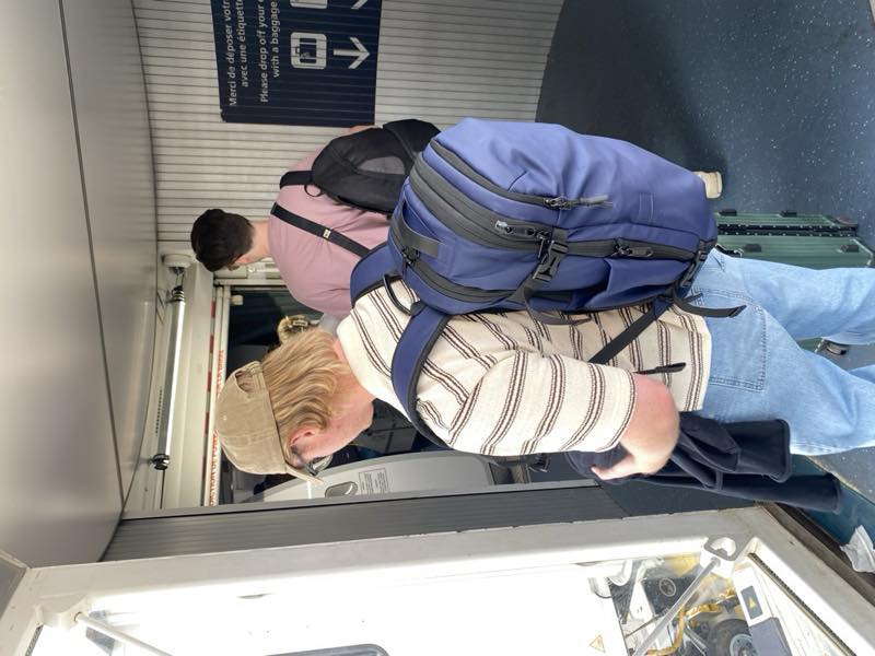 Adrian travelling with a blue Nomadity backpack