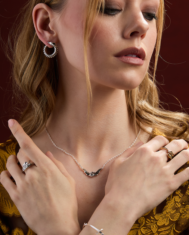 Enter the realm with the House of the Dragon collection. Featuring Syrax-inspired hoops, sword-detailed bracelets, bold helmet studs, and necklaces made to rule.