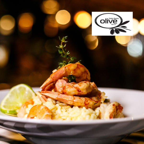 Grilled Shrimp resting on top of rice and the Outer Banks Olive Oil Co. Logo