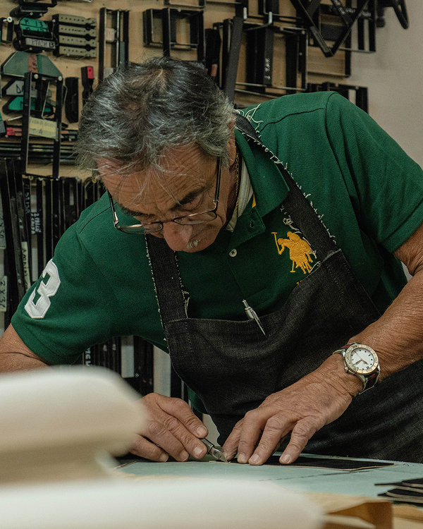 Editorial Image | Shoemaker working in workshop