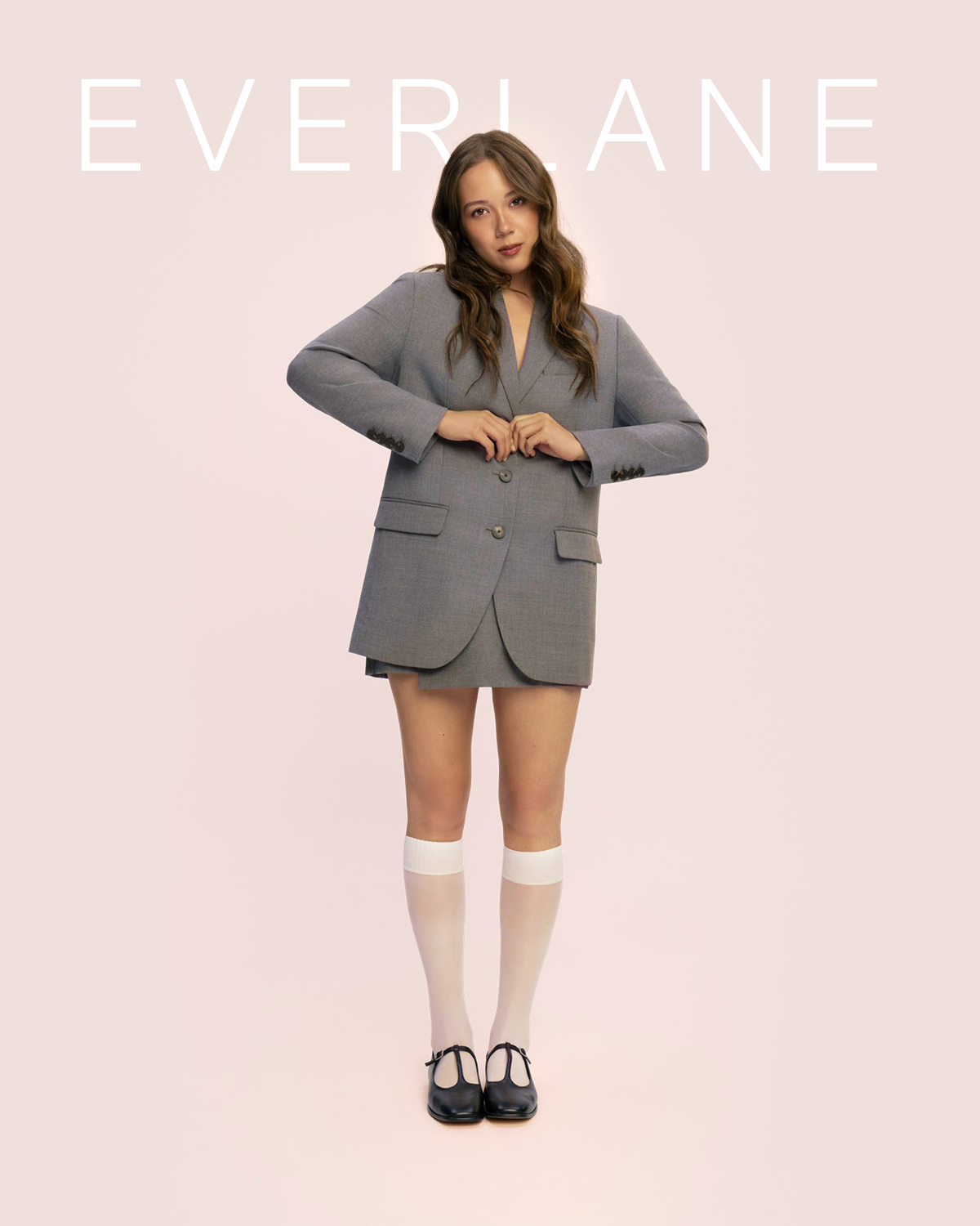 Everlane | Laufey in the  Blazer in Tailor Twill, Wrap Mini Skort in Tailor Twill and The Leather T-Strap Flat. 
