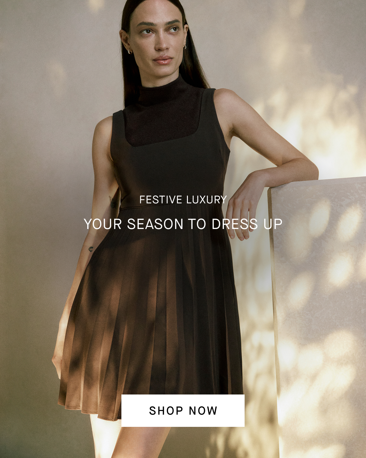 Image | Festive Luxury | Your Season to Dress Up | Model in Drapey Crepe Mini Dress  | Shop Now