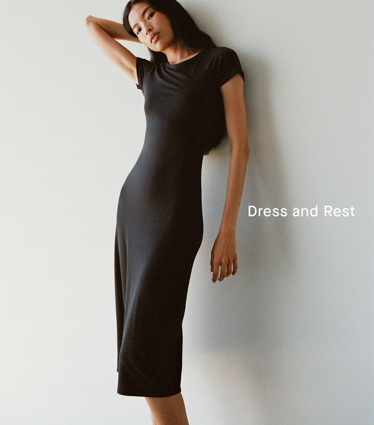 Everlane Logo | Image | Dress and Rest | Model in Raglan Midi Dress | Black