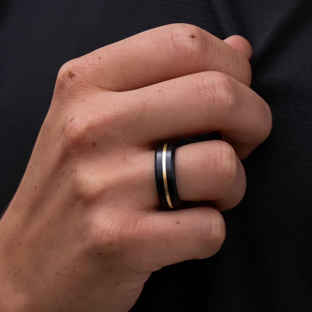 an image of a man wearing a ring with a black band