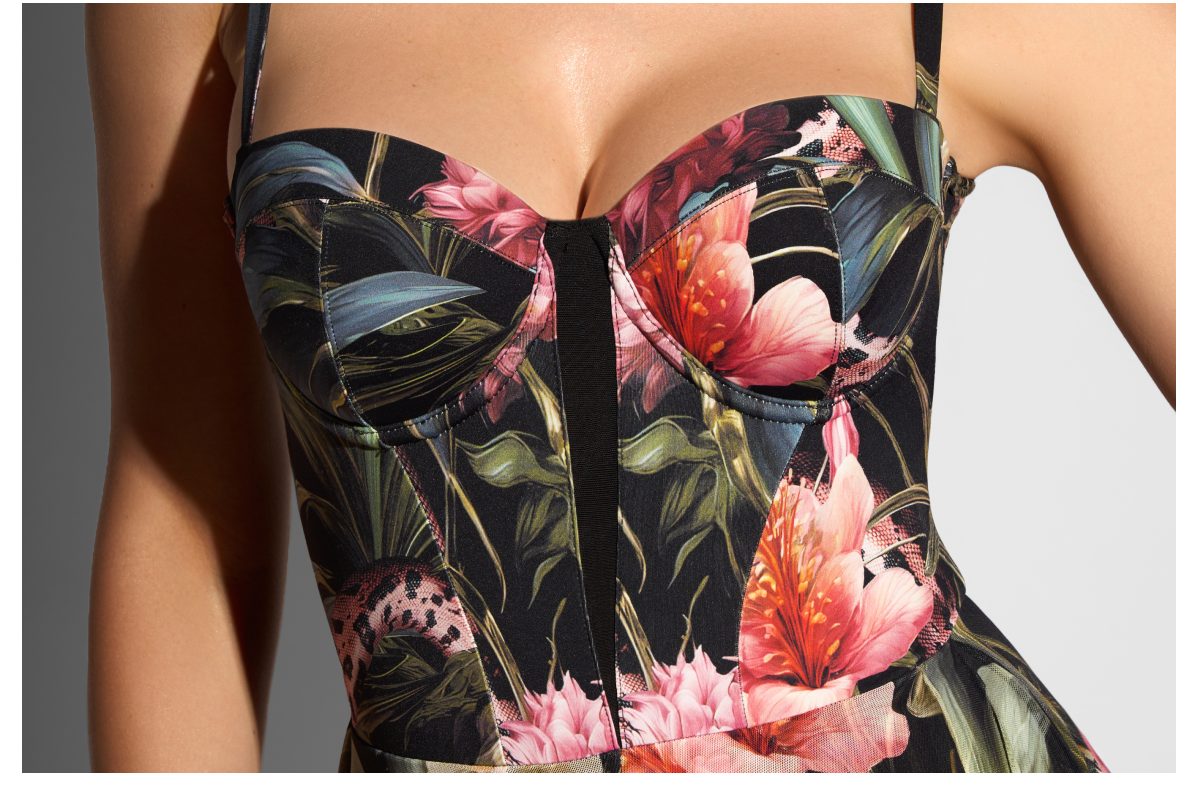 Floral print dress with a sweetheart neckline and structured bodice featuring large pink and orange flowers.