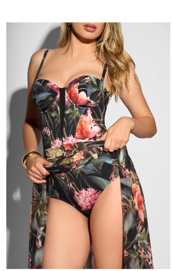 Floral print swimsuit with a fitted bodice and high-waisted bottom, paired with a sheer cover-up.