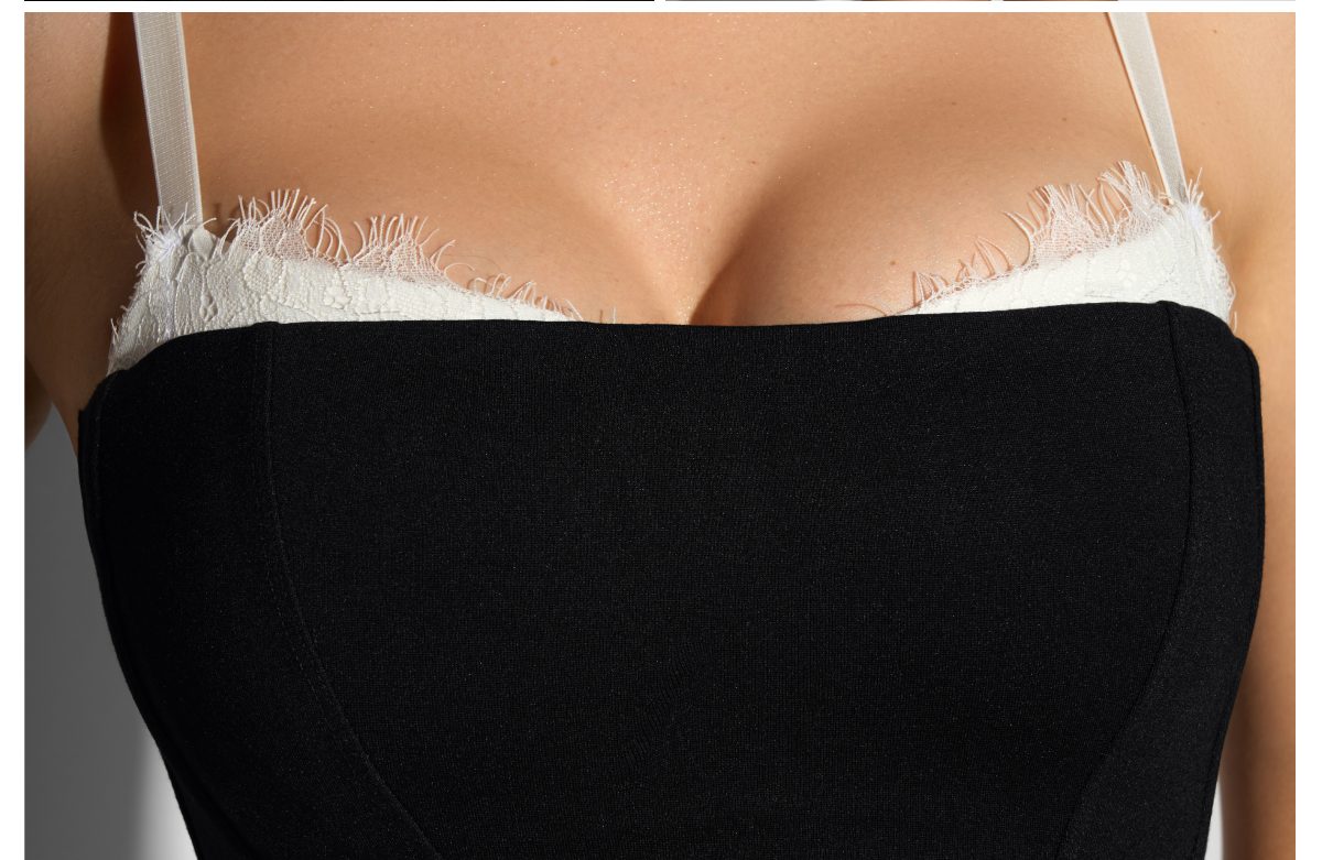Black dress with white lace trim at the neckline.