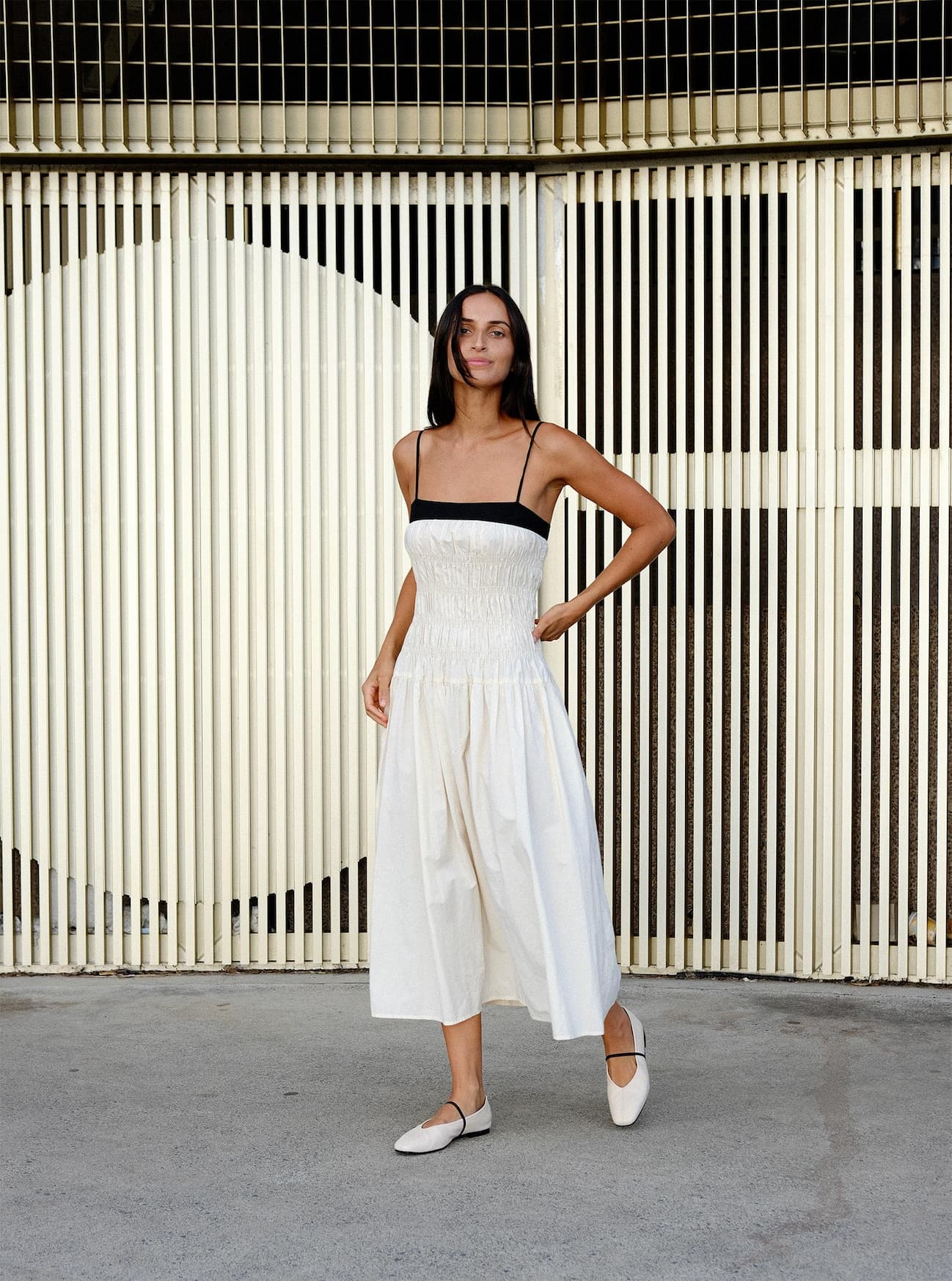 an image of a woman standing in front of a wall