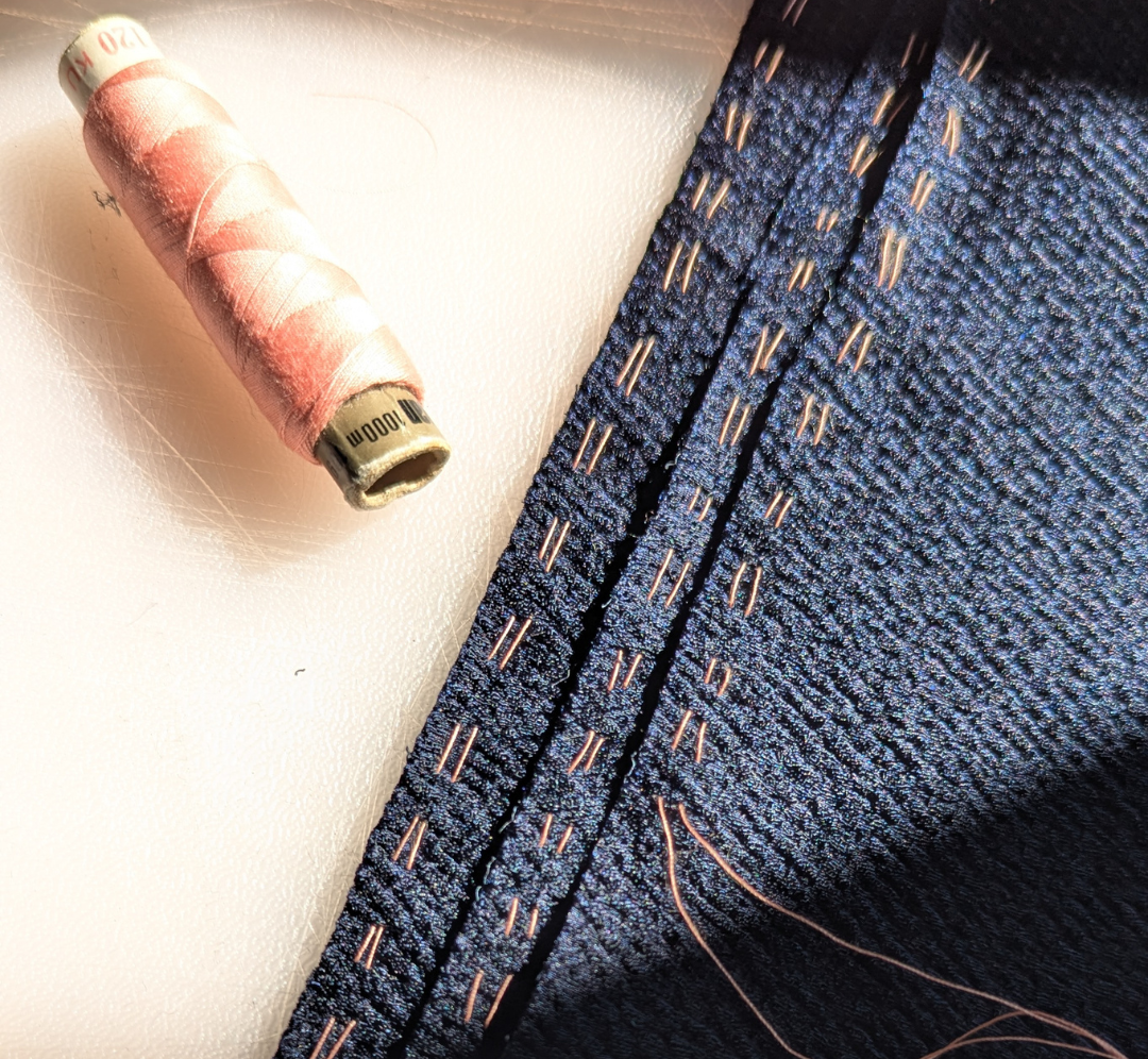 Hand stitched gathers on satin