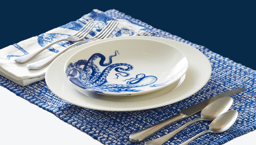 Lucy the Octopus table setting with plates and napkins
