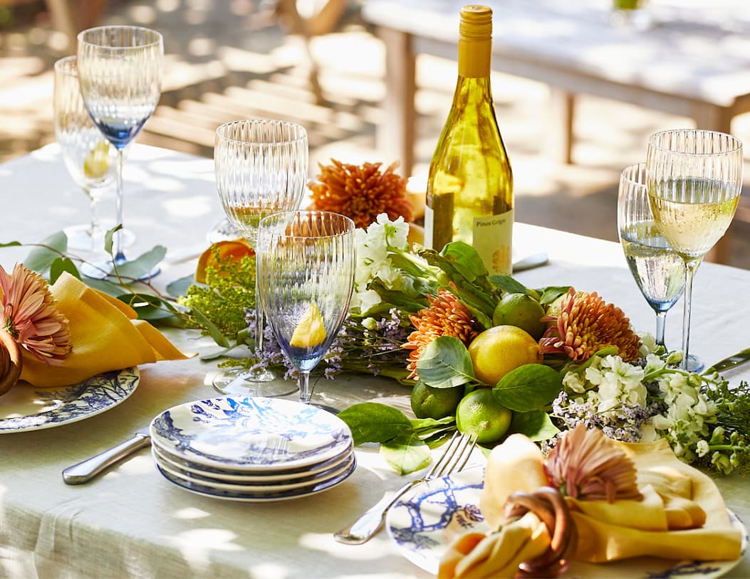 Caskata tablescape featuring Quinn glassware and botanical blue dinnerware