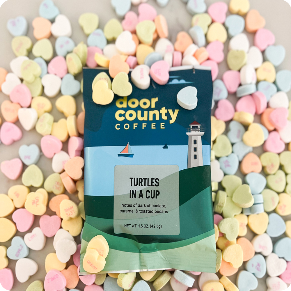an image of a cup of coffee and some cookies on a table