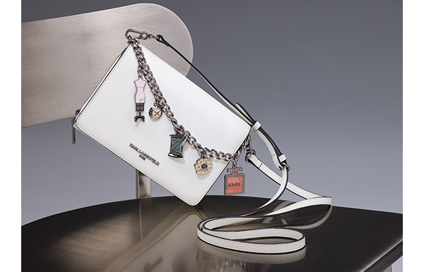 an image of a white purse with a chain hanging from it