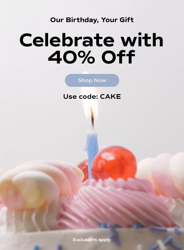 A close-up of a cupcake topped with pink frosting, colorful swirls, a cherry, and a single blue candle that flickers before being blown out. The email says: Our birthday, your gift. Celebrate with 40% off your purchase July 14th only. Shop Now. Use code: CAKE. Exclusions apply.