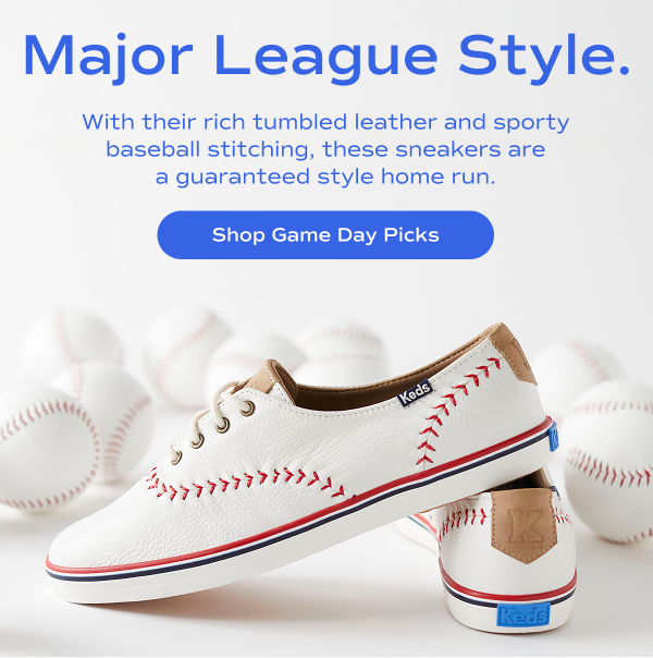 An image featuring the Keds Champion Pennant leather lace-up shoes in off-white with red baseball-style stitching, brown leather heel tab, and blue-and-red striped sole. The background is filled with baseballs. Text on the image reads: "Major League Style. With their rich tumbled leather and sporty baseball stitching, these sneakers are a guaranteed style home run." A blue button below the text says, "Shop Game Day Picks."