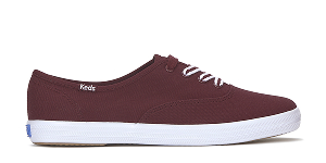 A side view of the Keds Champion Canvas Lace-Up in burgundy.