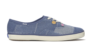 A side view of the Keds Champion Denim Patchwork Charm Lace-Up in navy.