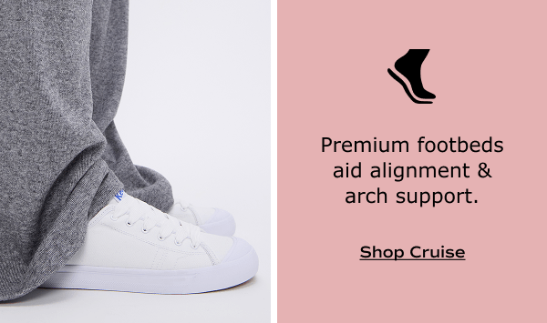 The Cruise Canvas Slip-On in white shown on foot paired with loose cashmere sweatpants. White text on a blush background says, Premium footbeds aid alignment and arch support. Shop Cruise.