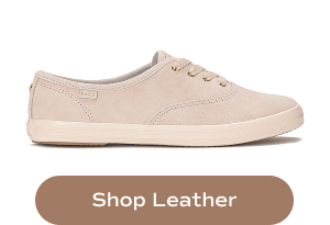 A profile view of the Keds Champion Luxe Suede Lace-Up in blush. Shop Leather.