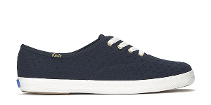 A side view of the Keds Champion Mini Daisy Eyelet in navy.