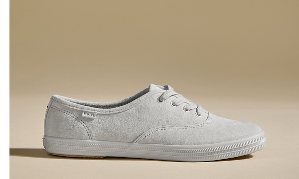 A side view of the Keds Champion Luxe Suede Lace-Up in grey.