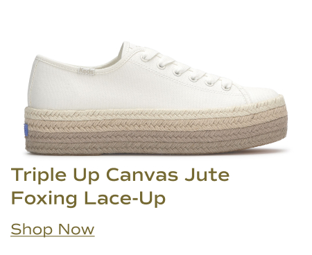 A side view of the Keds Triple Up Canvas Jute Foxing Lace-Up sneaker in white, featuring a white canvas upper and a triple-layered jute-wrapped platform sole. Shop Now.