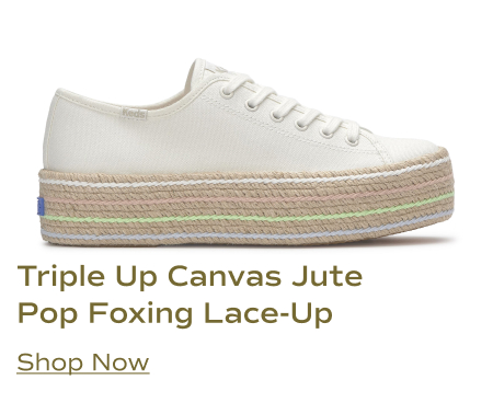 A side view of the Keds Triple Up Canvas Jute Pop Foxing Lace-Up sneaker in white, featuring a white canvas upper and a triple-layered jute-wrapped platform sole with pastel pink, light blue, and light green stripes. Shop Now.