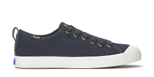 A side view of the Cruise Mini Daisy Eyelet Slip-On in navy.