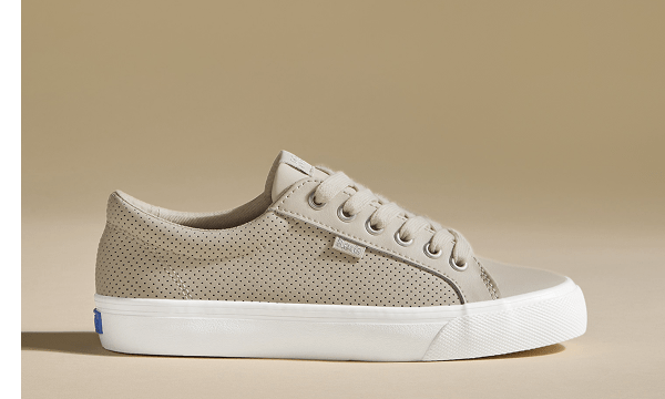 A side view of the Jump Kick Perforated Leather Lace-Up in oatmeal. 