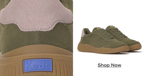 A closeup of the back of the suede Contest Lace-Ups in olive suede, the sneaker has a pink heel tab and a blue Keds logo underneath. A pair of the same sneakers sit next to it. Shop Now.