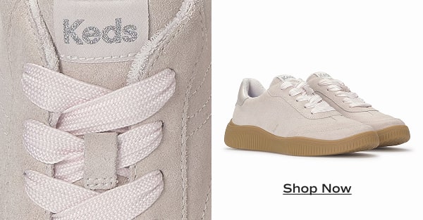 A closeup of the tonal laces on the Contest Lace-Up in light pink suede next to a pair of the same sneakers. Shop Now. 
