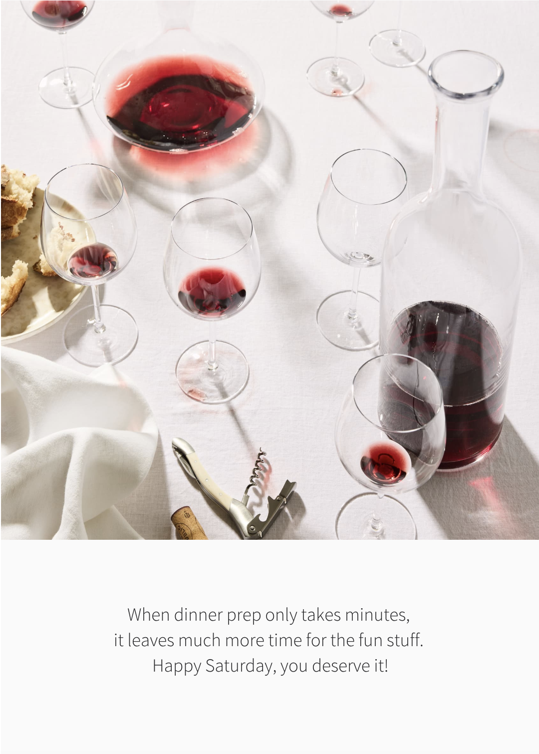 an image of a table with wine glasses and bread